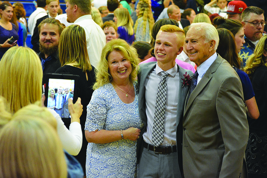 Kasen Miller taking family photos after the ceremony.